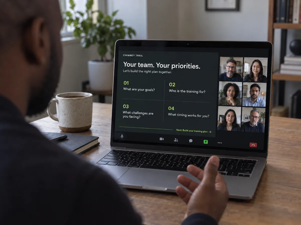 Planning call on a laptop with a team, reviewing goals, audience, challenges, and timing