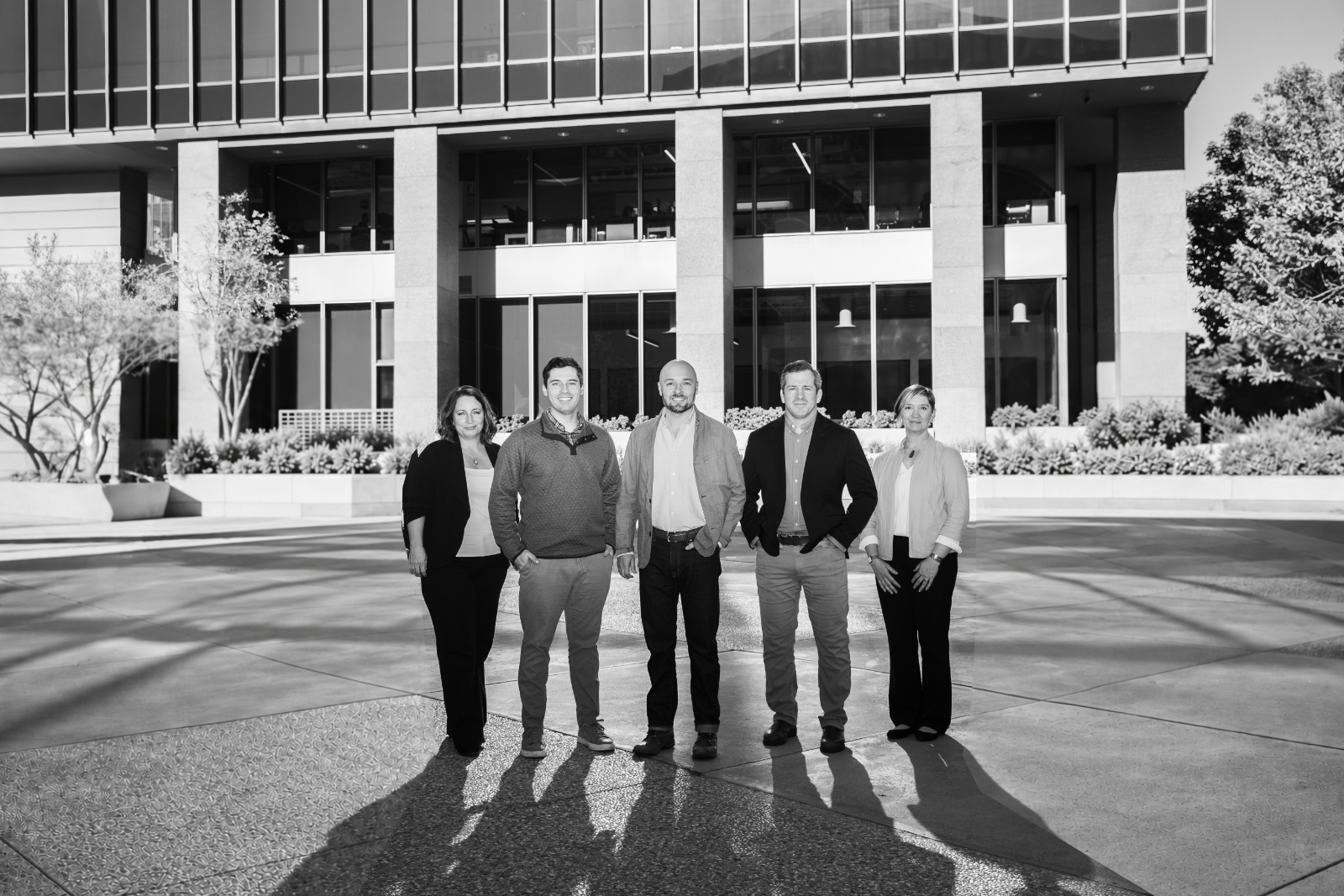 The Chimney Trail team standing together outside an office building